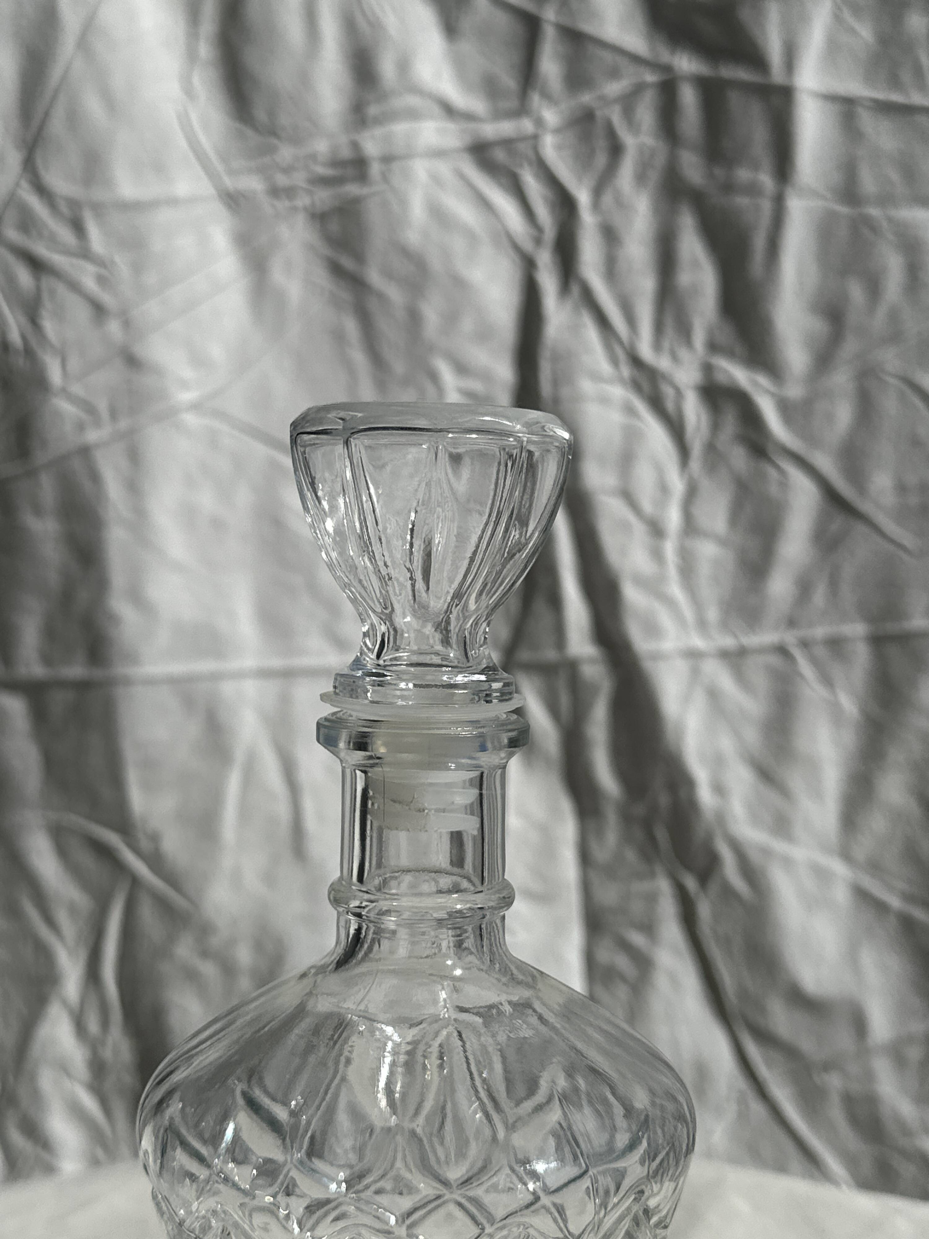 Small cylindrical glass whiskey decanter H:23