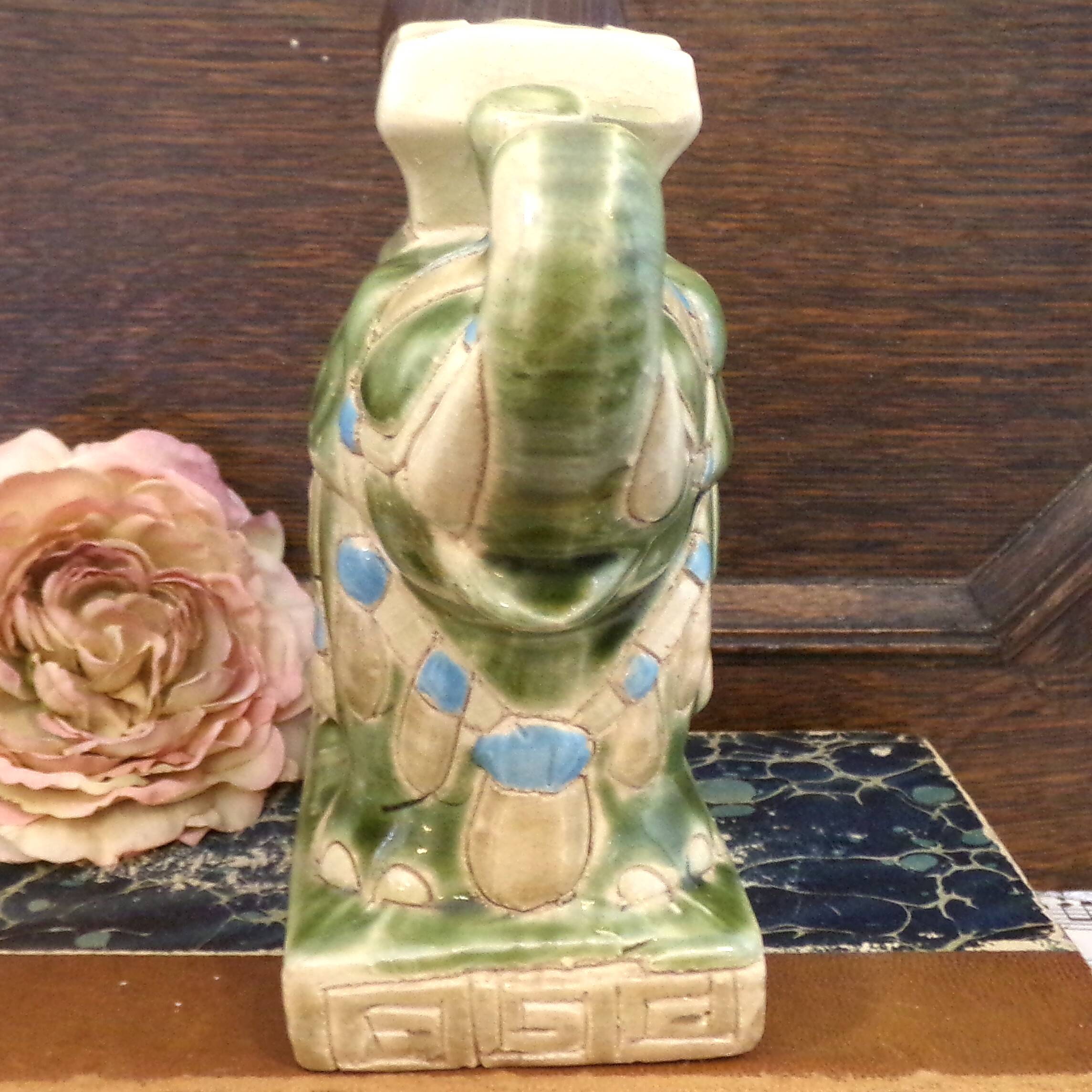 Small green ceramic elephant vase
