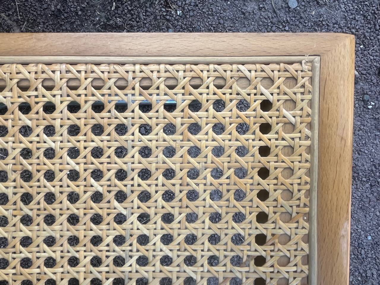 Wooden chair with caning in the style of Marcel Breuer.