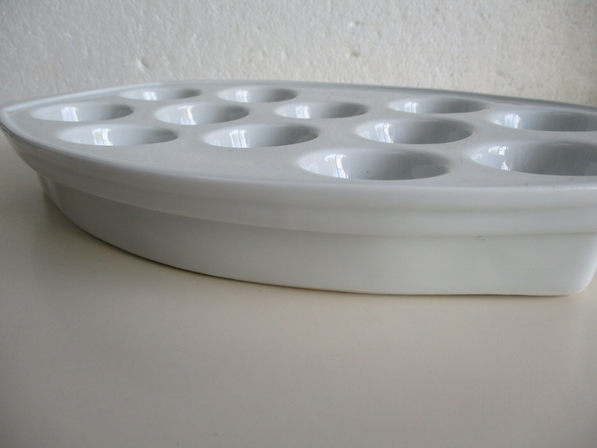 White porcelain snail dish