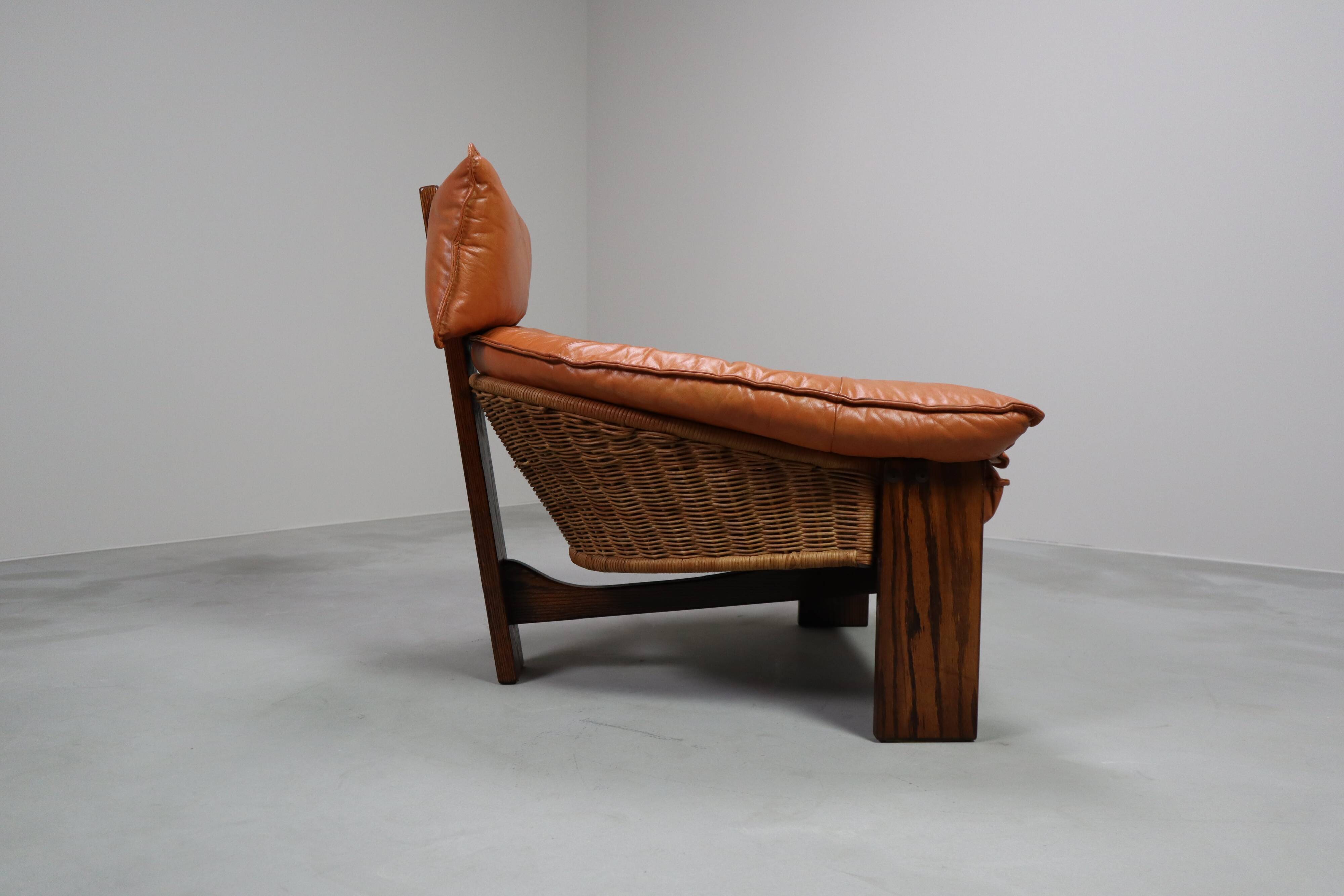 Vintage tripod lounge chair in leather, rattan and oak, Netherlands