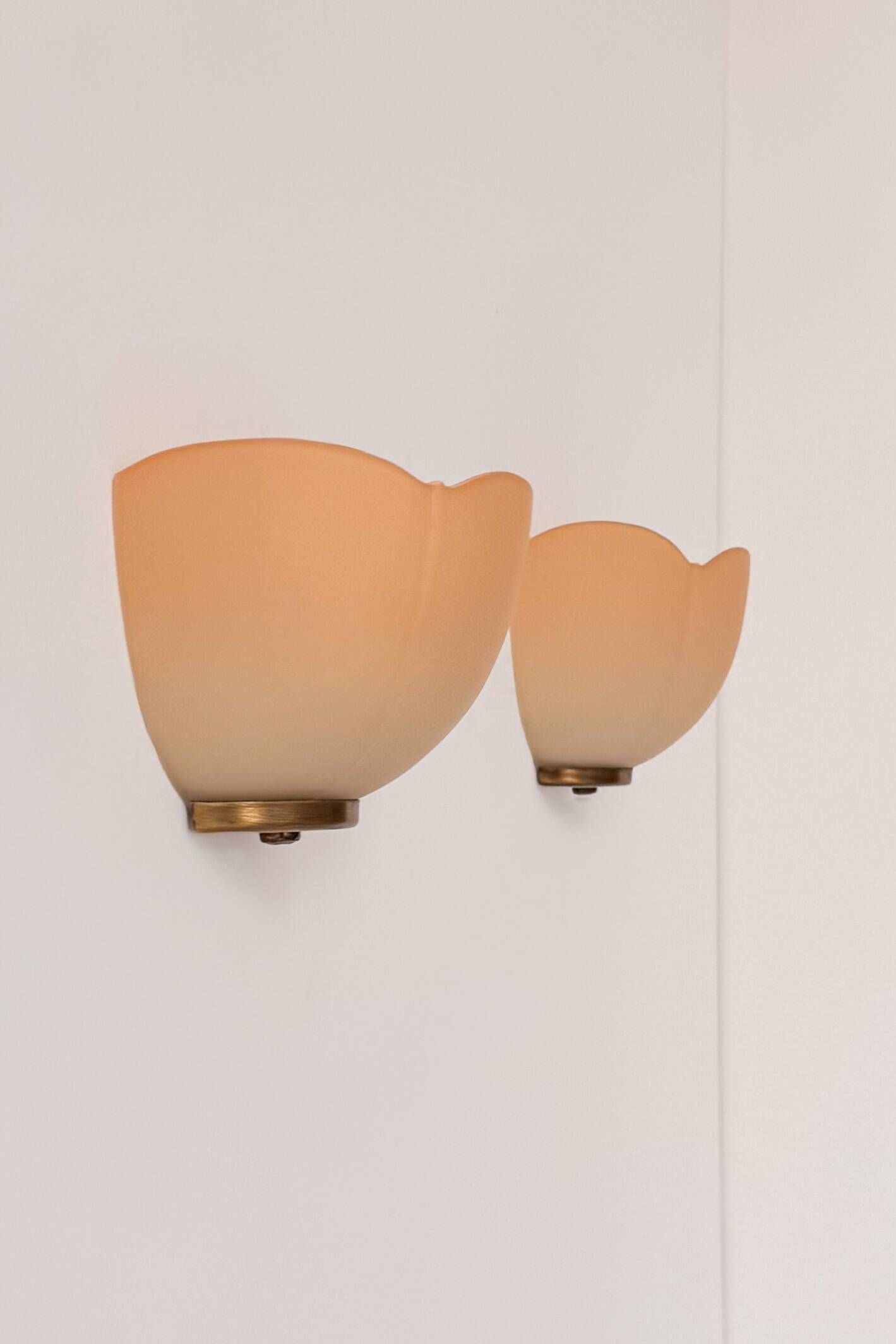 Vintage brass and orange glass wall sconces, France 1970.
