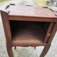 Pair of oak bedside tables with curtained niche doors
