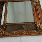 Mirror with parecloses