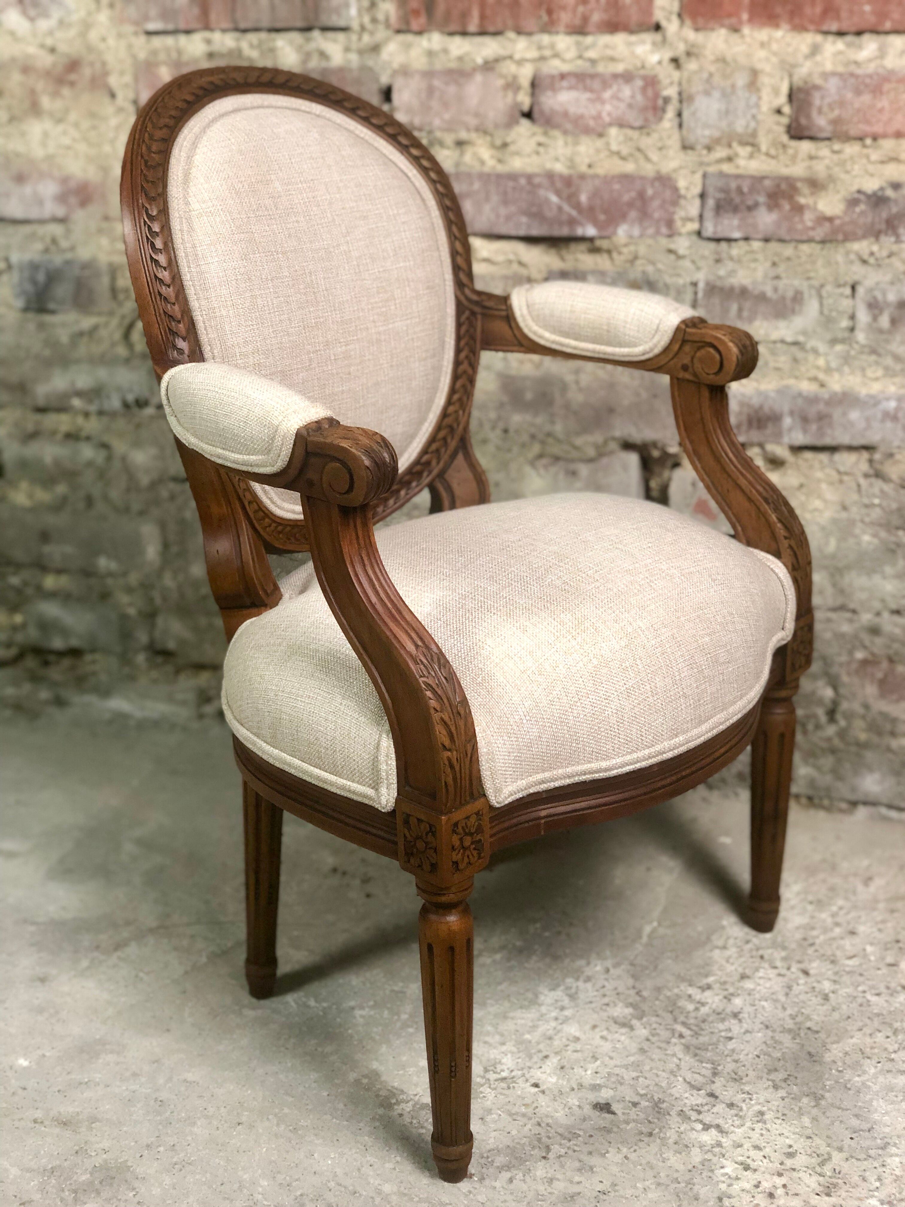 Louis XVI style children's armchair in carved walnut and beige antique upholstery