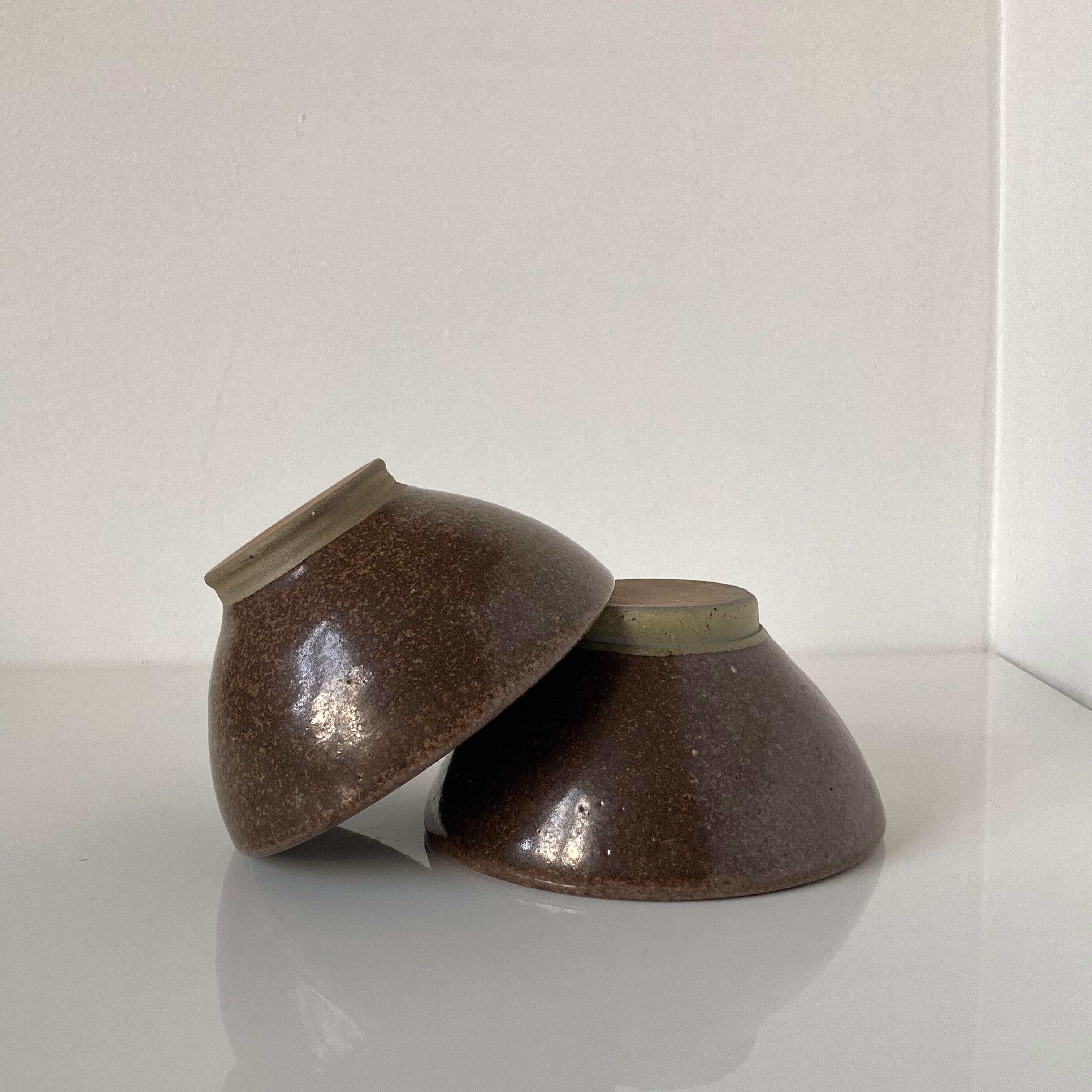 Pair of Japanese temoku bowls in brown glazed stoneware