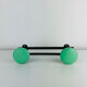 Wall-mounted coat rack with 2 green hooks from the 1950s.