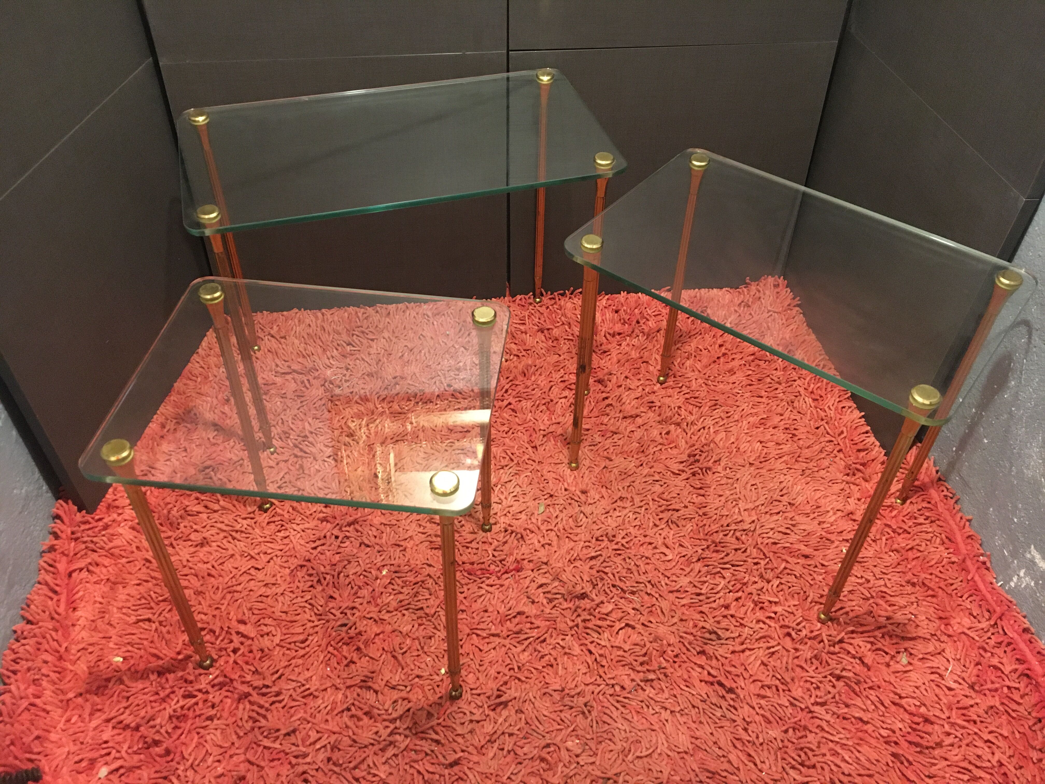 Brass and glass trundle tables