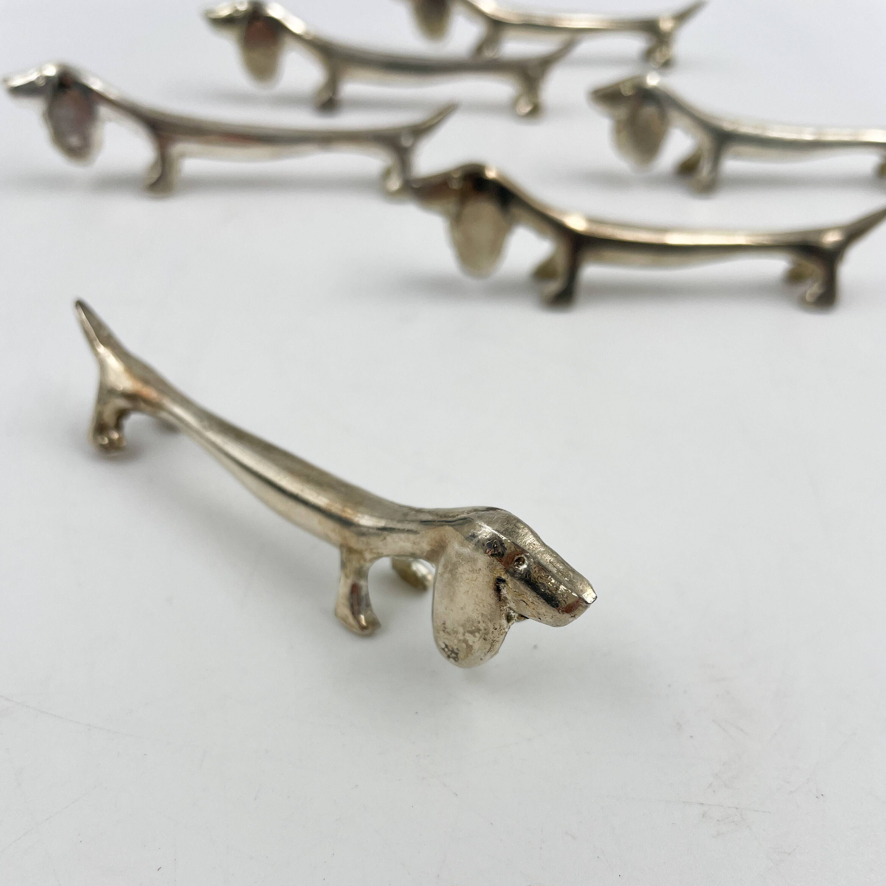 Set of 6 silver metal Dachshund knife holders, 1970s