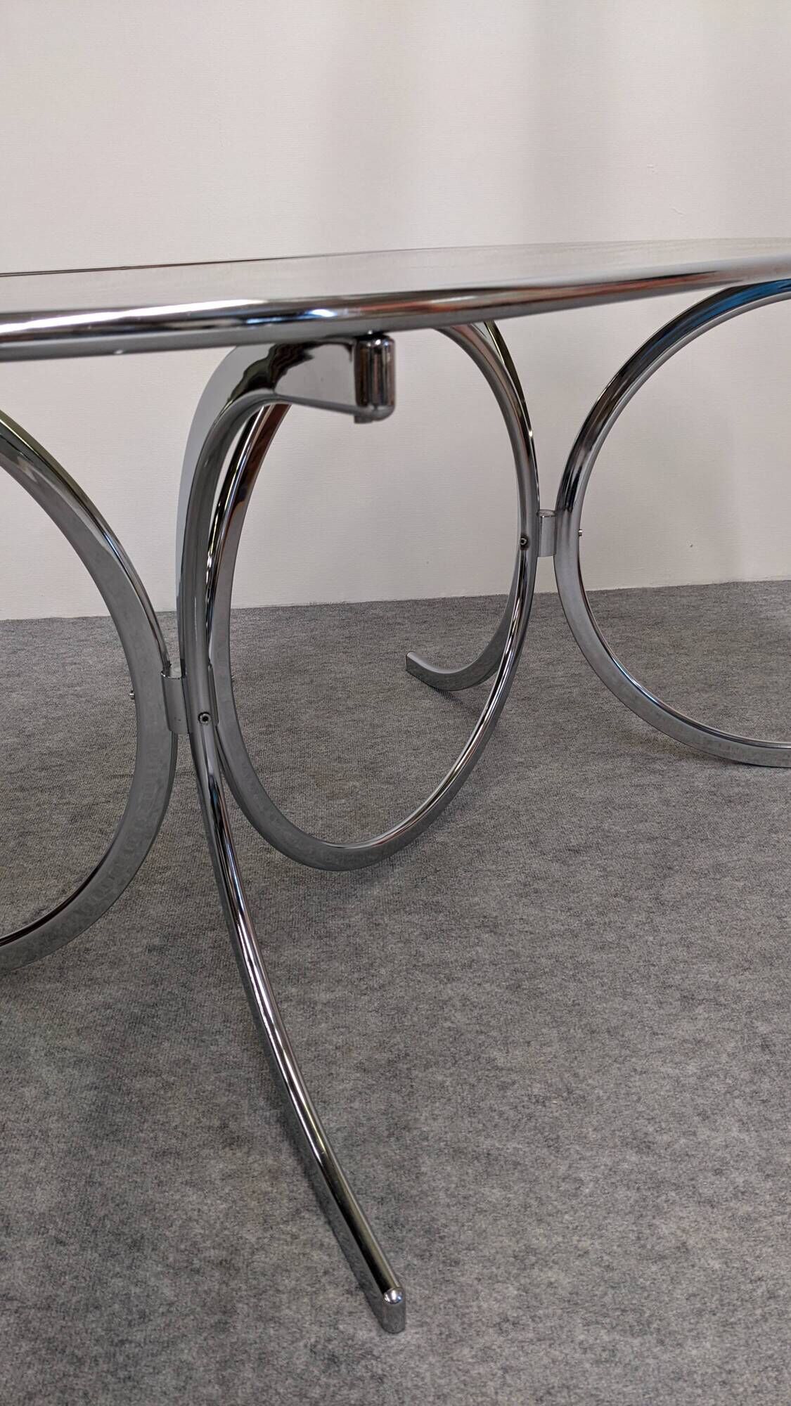 Oval dining table in chromed metal and smoked glass, Italy circa 1970