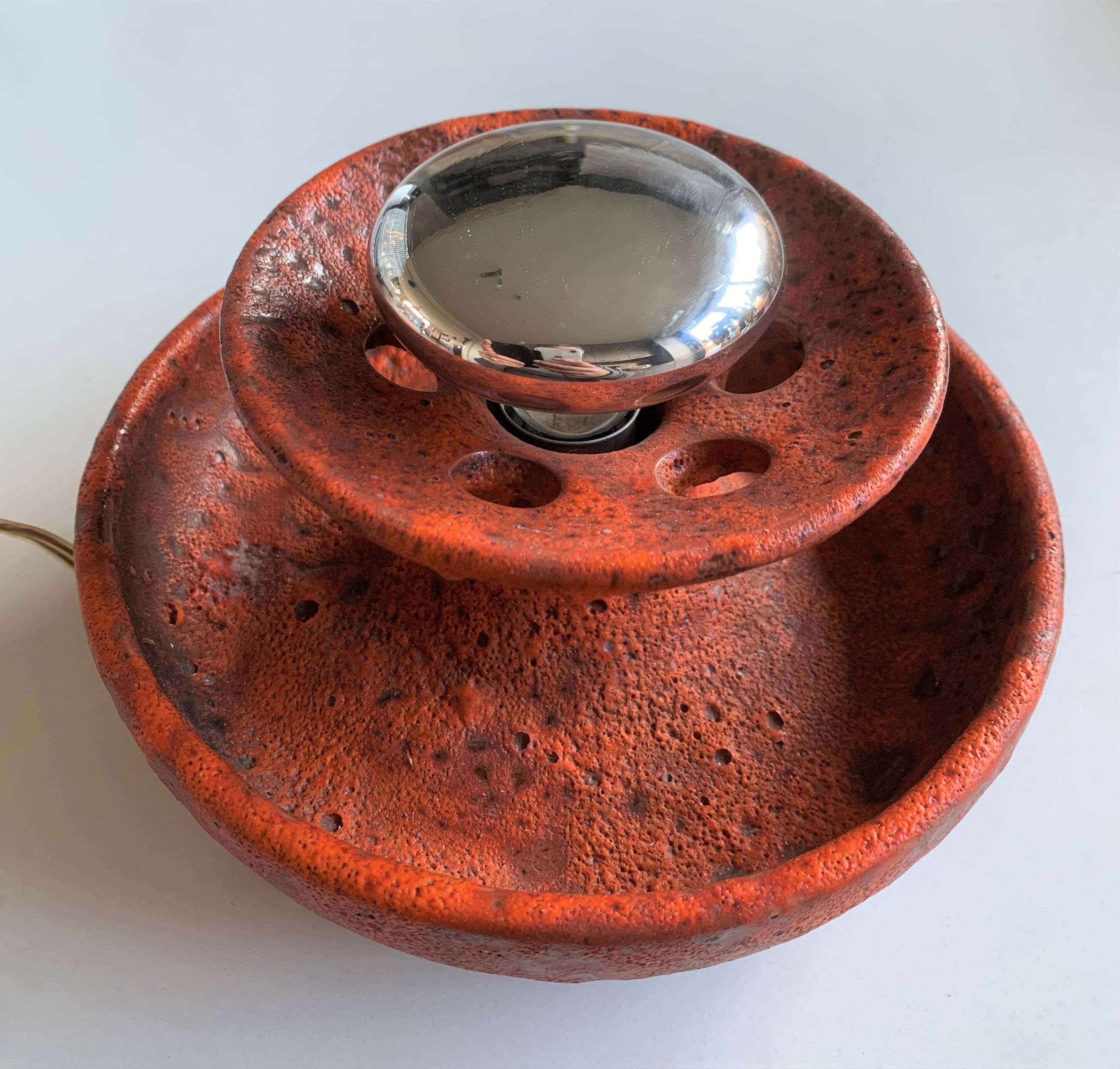 Ambient spot in orange glazed terracotta from the 1960s