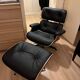 Fauteuil et ottoman Charles Eames en bois de palissandre et cuir