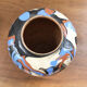 Vase dripping in varnished earth