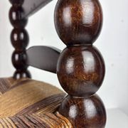 Brutalist wood turned bobbin low rush chair n the style of Charles Dudouyt