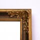 Mirror in a decorative gold frame, 63.5 x 54 cm