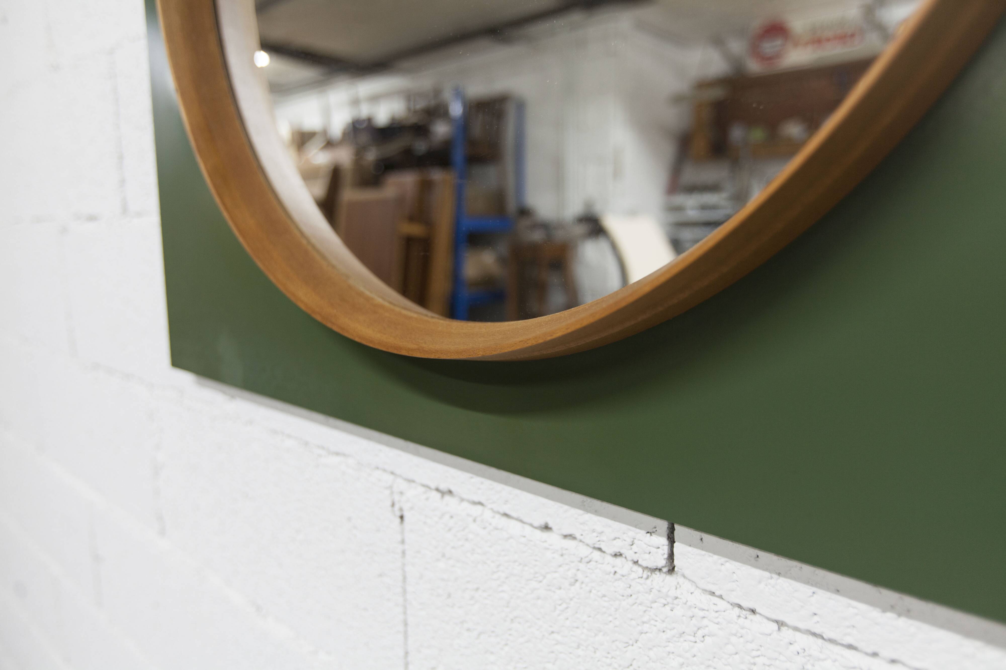 Unusual round wall mirror 60 cm teak edge on green rectangular board 1960.