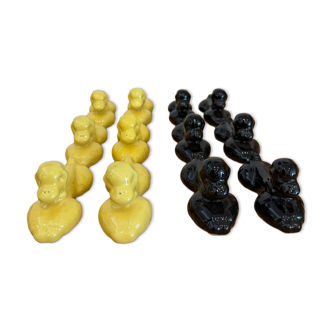 Box of 12 dog-shaped cutlery rests in yellow and black majolica.
