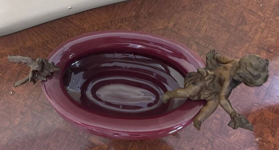 Catch-all or decorative bowl combining a ceramic container.