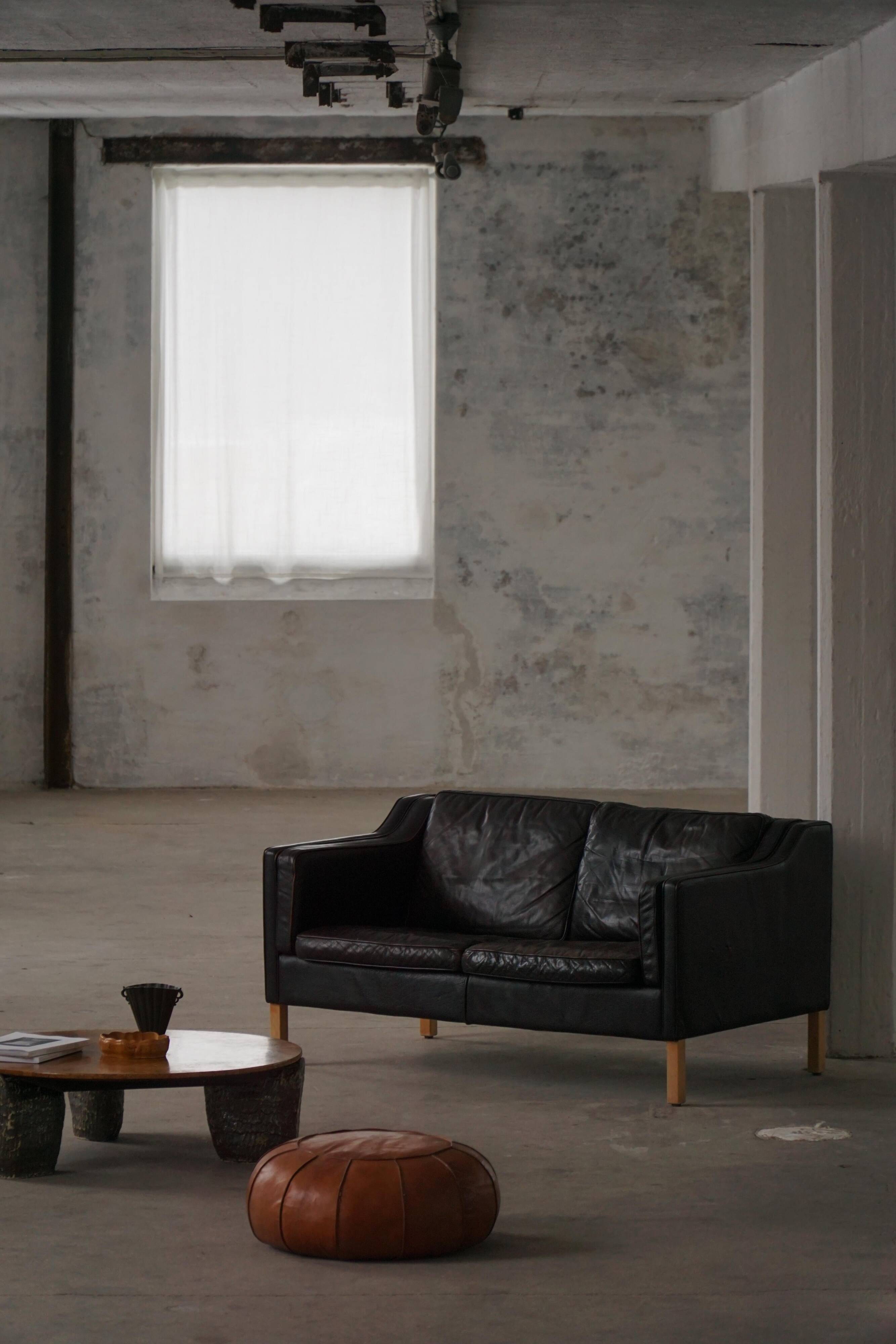 Mogens Hansen, mid-century 2-seater sofa, patinated black leather, 1970s.