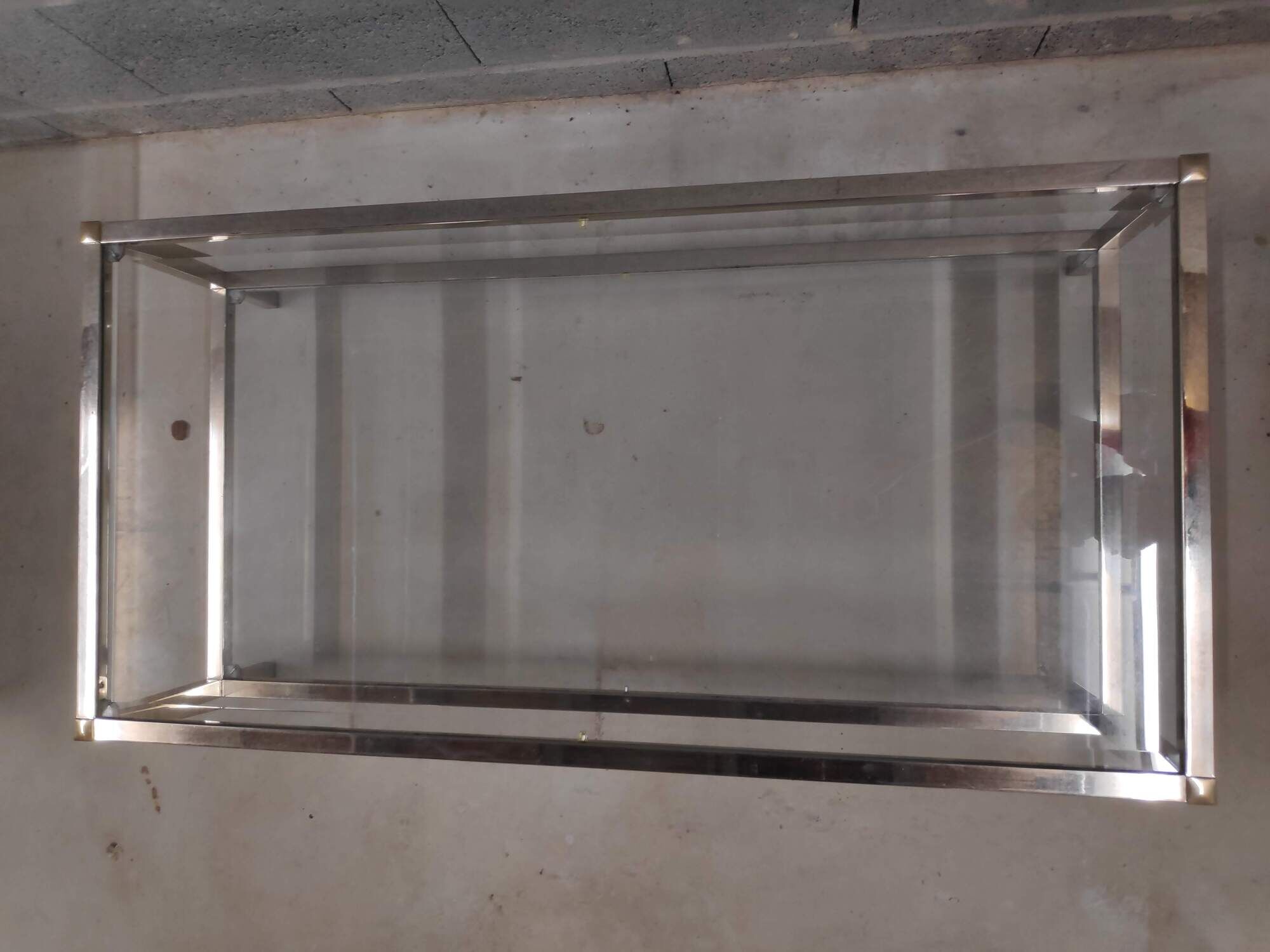 Vintage bevelled glass coffee table and lightly gilded square metal tubes from the 70s/80s