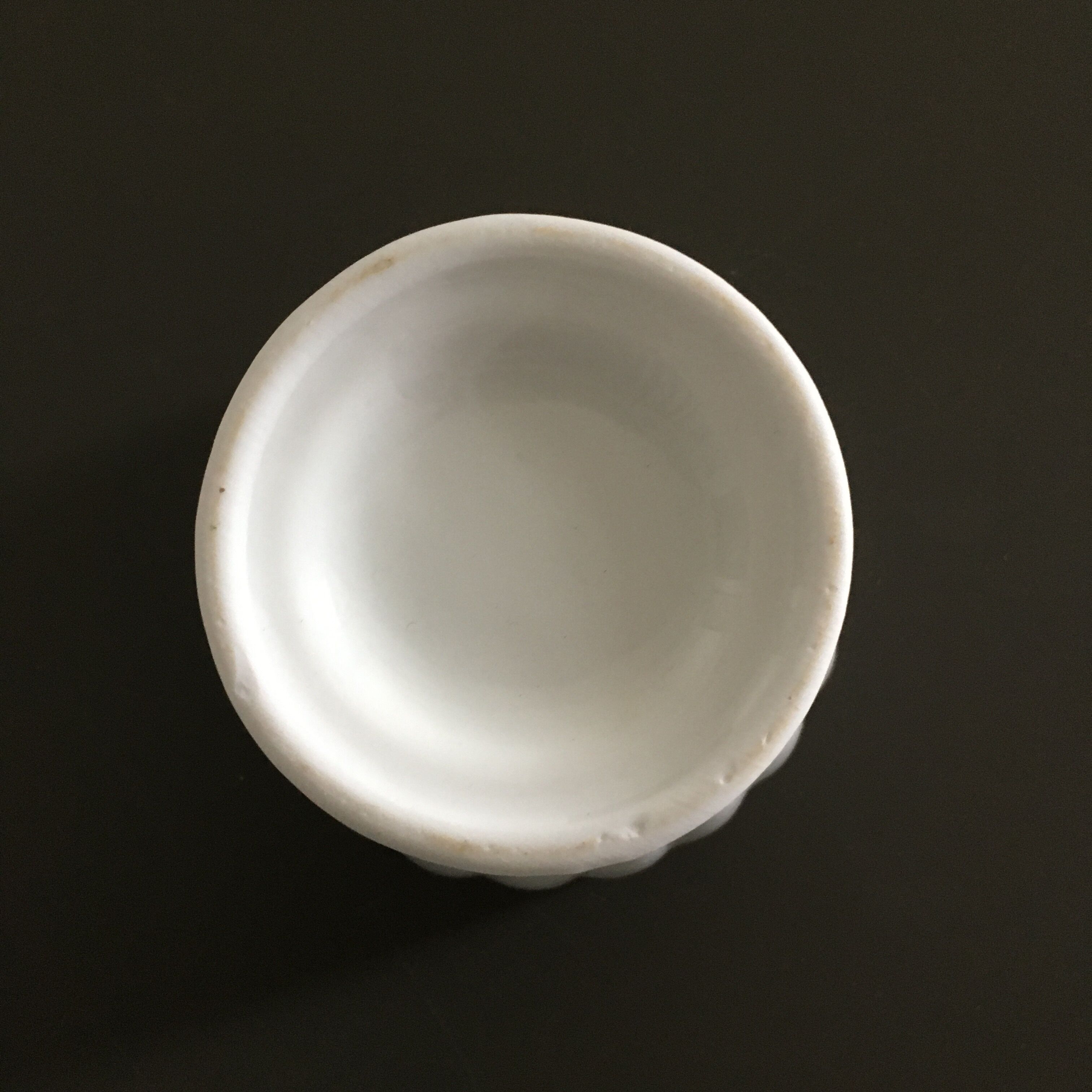 Scalloped porcelain bowl