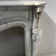 Louis XV style fireplace in veined white Carrara marble, 19th century.