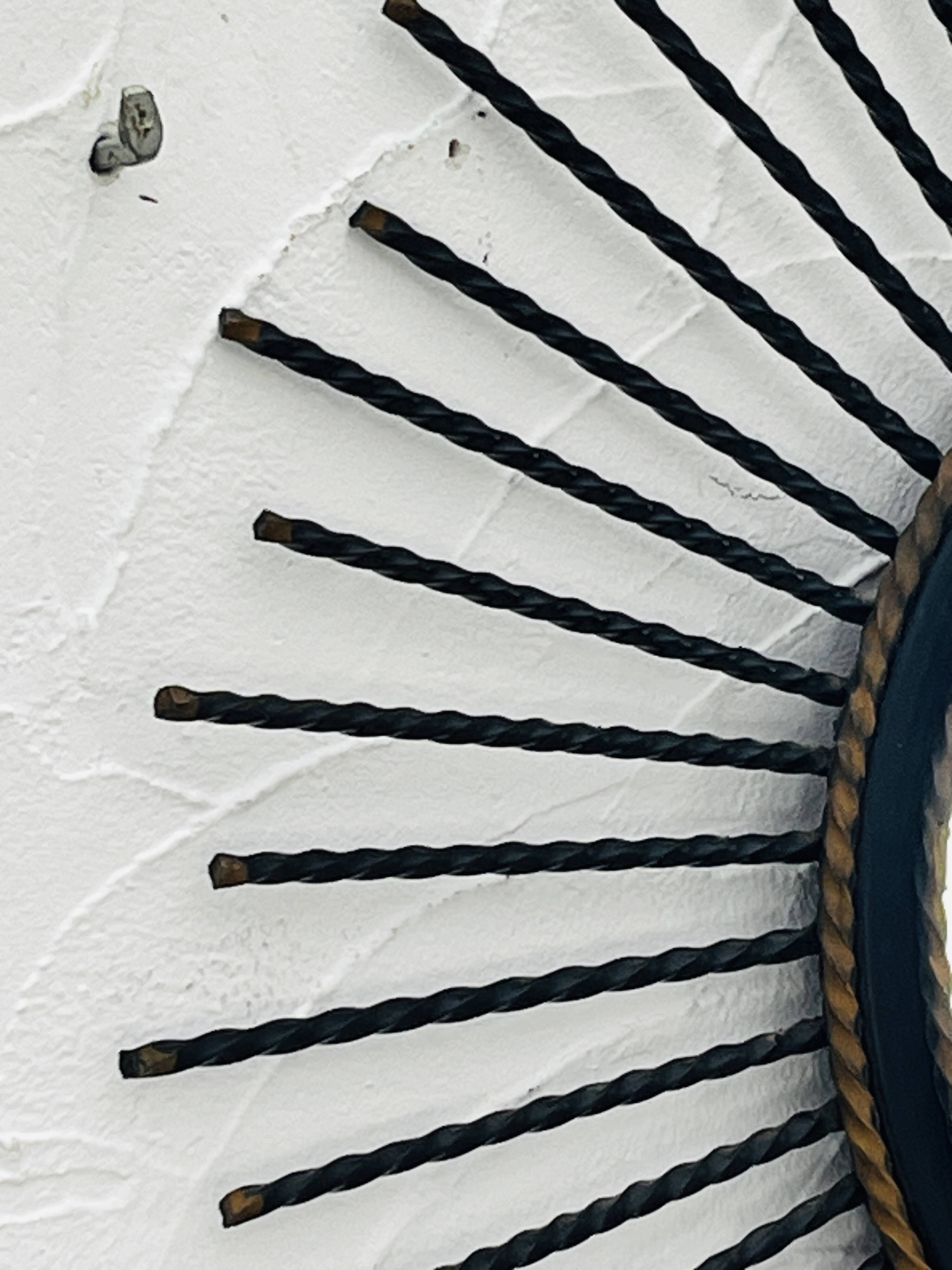 Vintage black and gold metal sun mirror from the 1960s.