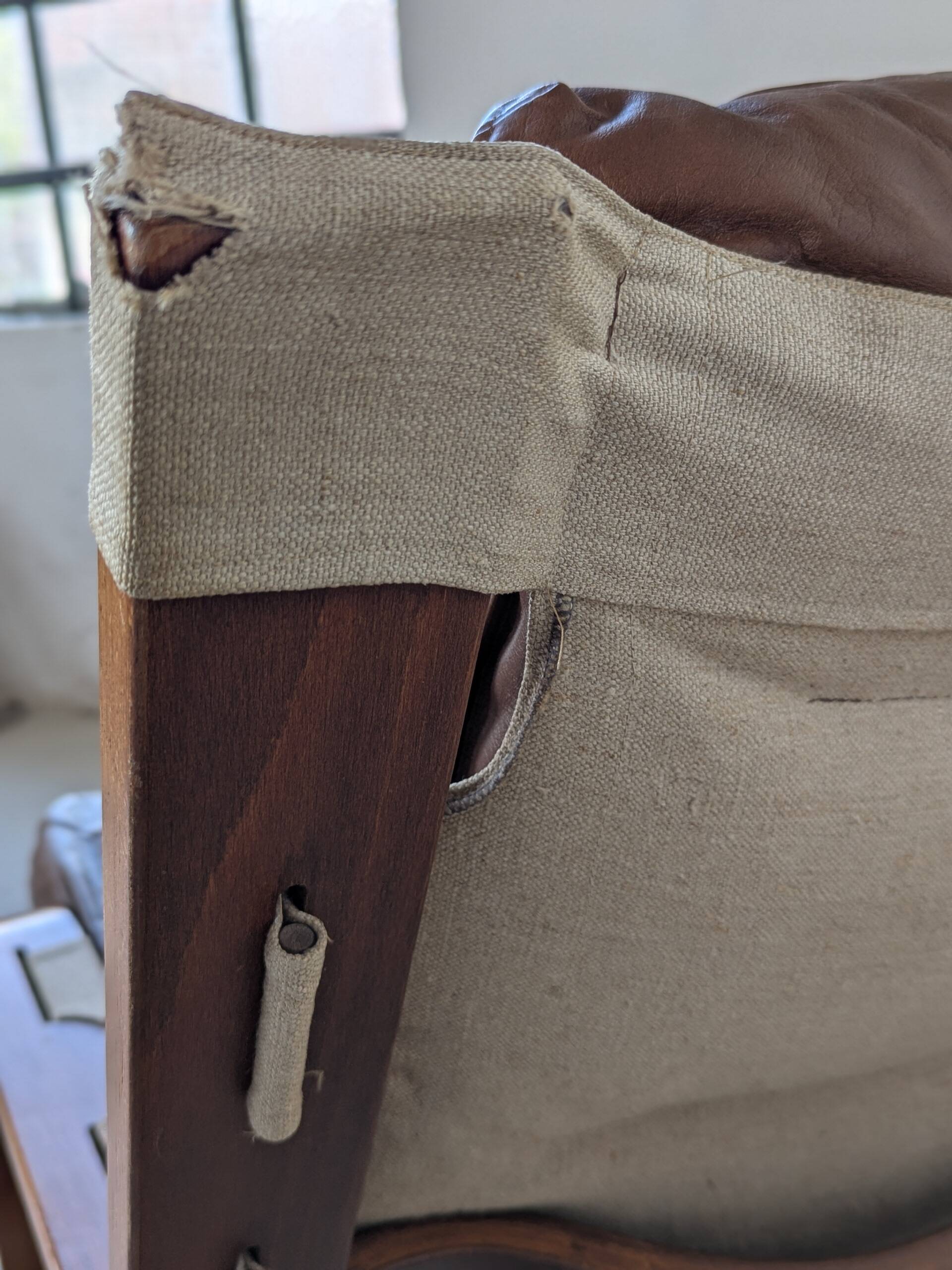 Leather and wood armchair, brutalist style.