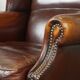Dark English style sheepskin wingback chair with character and patina