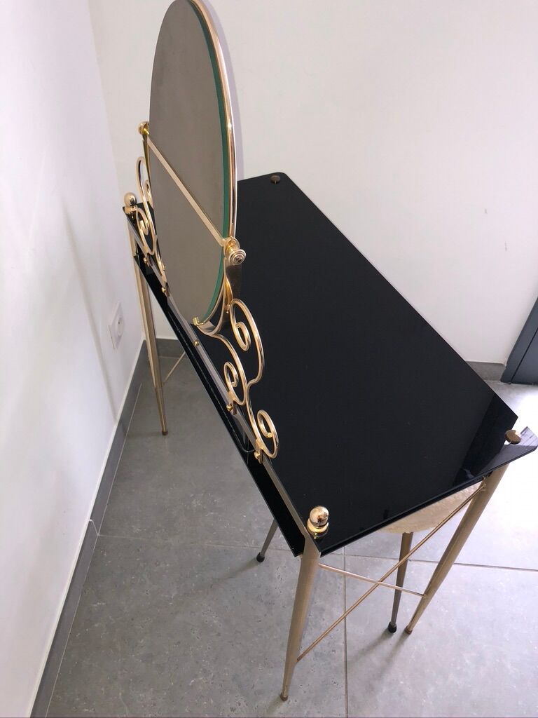 Brass hairdresser, glass and black plastic with its fluffy stool.