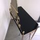 Brass hairdresser, glass and black plastic with its fluffy stool.