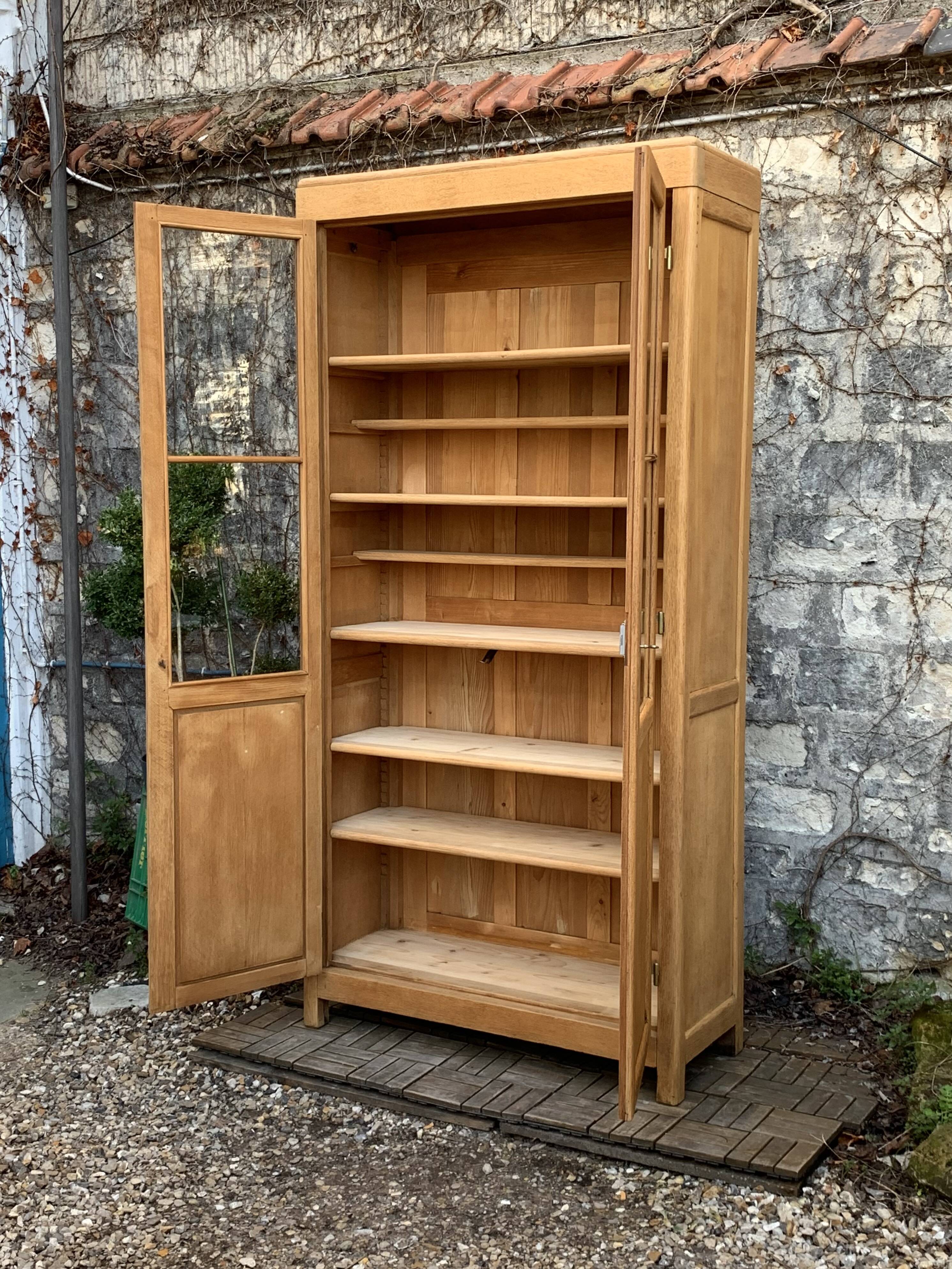 Parisian glass cabinet in solid raw oak, 1950
