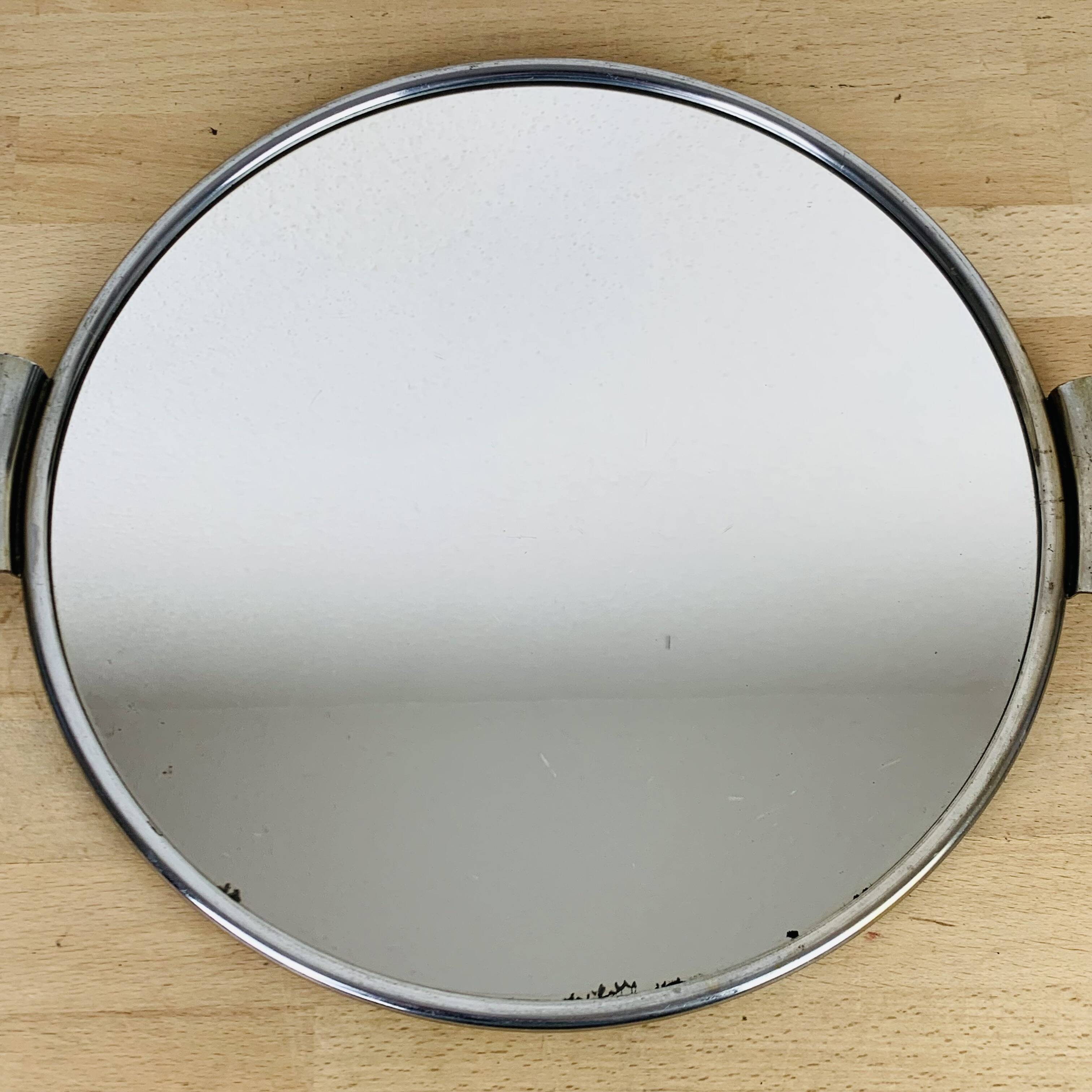 Round mirror plateau from the 1950s.