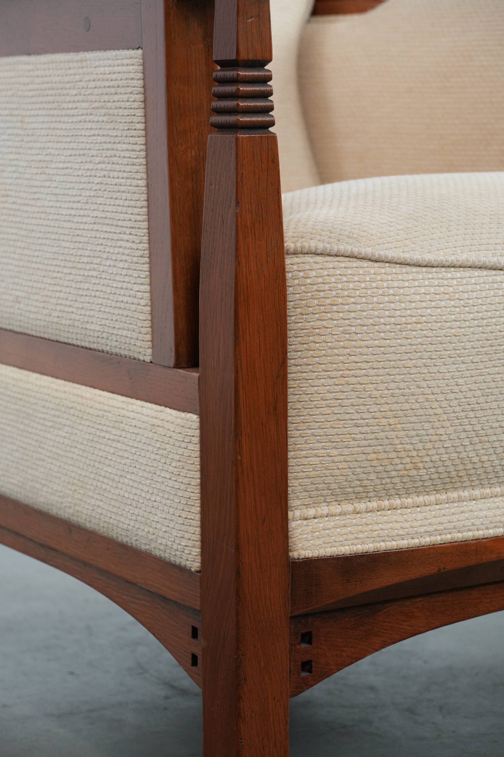 Art Nouveau design armchair with a luxurious light fabric upholstery