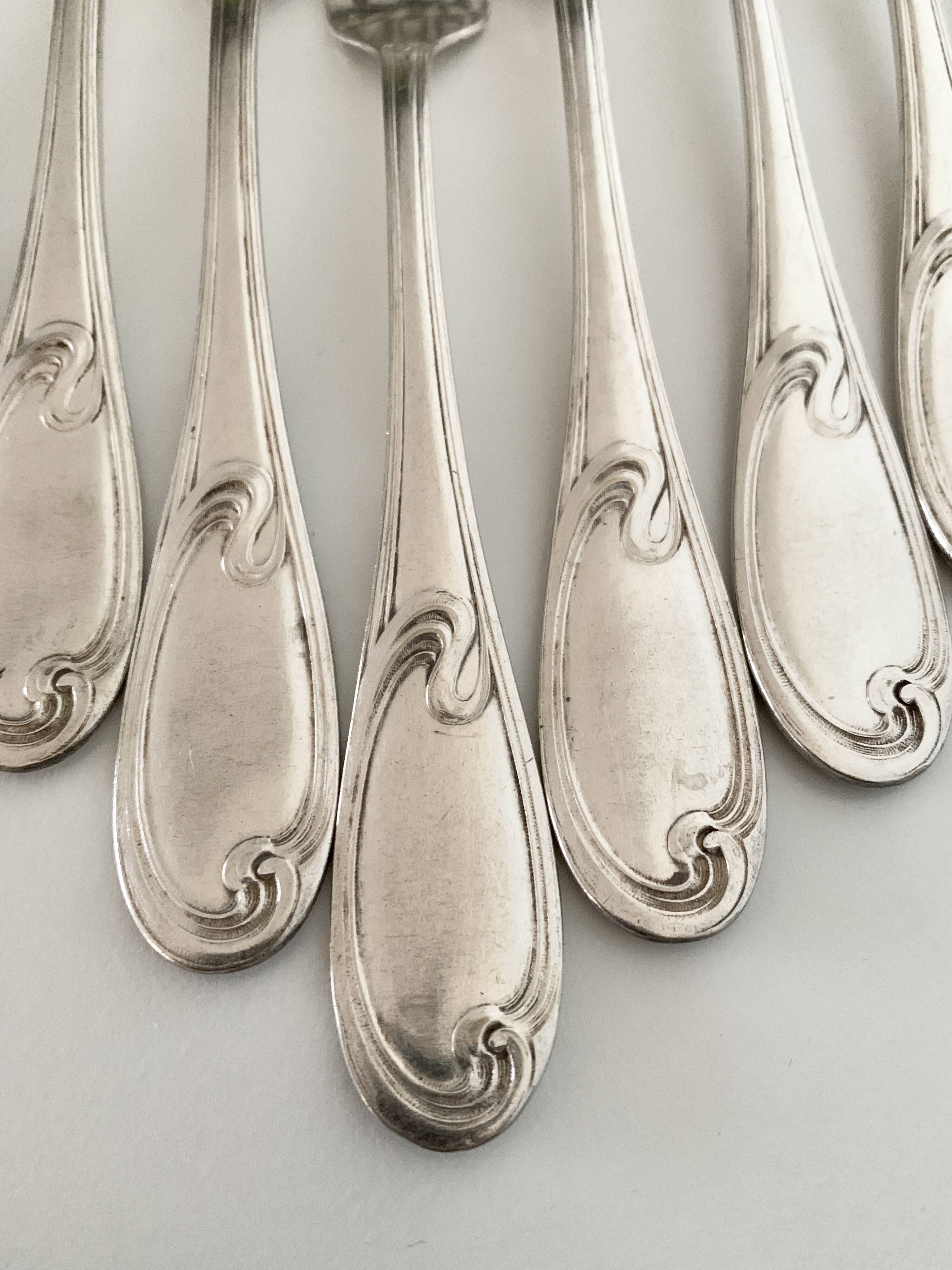 Nine large Ercuis silver-plated forks
