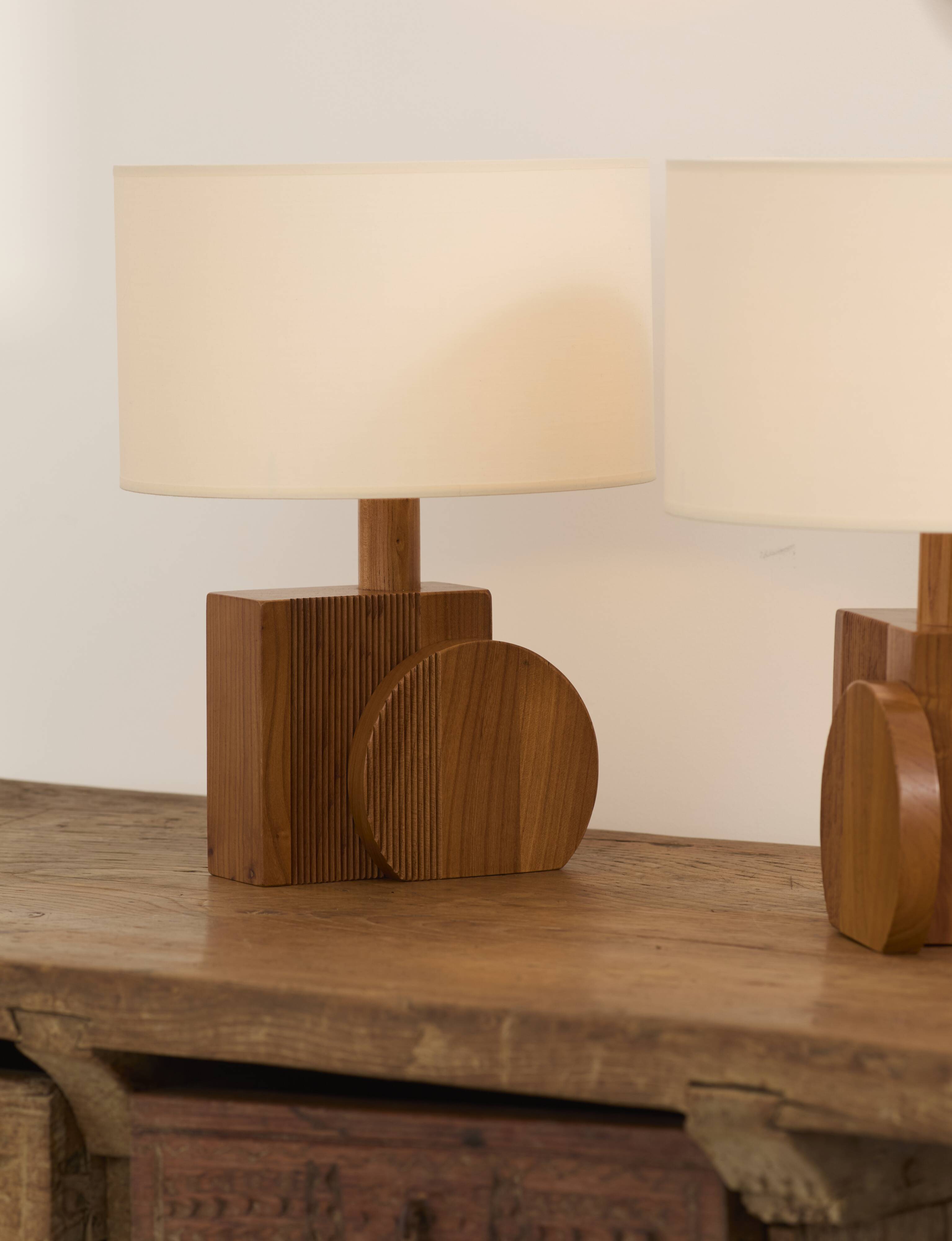 Pair of geometric handcrafted lamps in solid oak circa 1970.