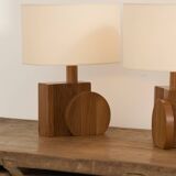 Pair of geometric handcrafted lamps in solid oak circa 1970.