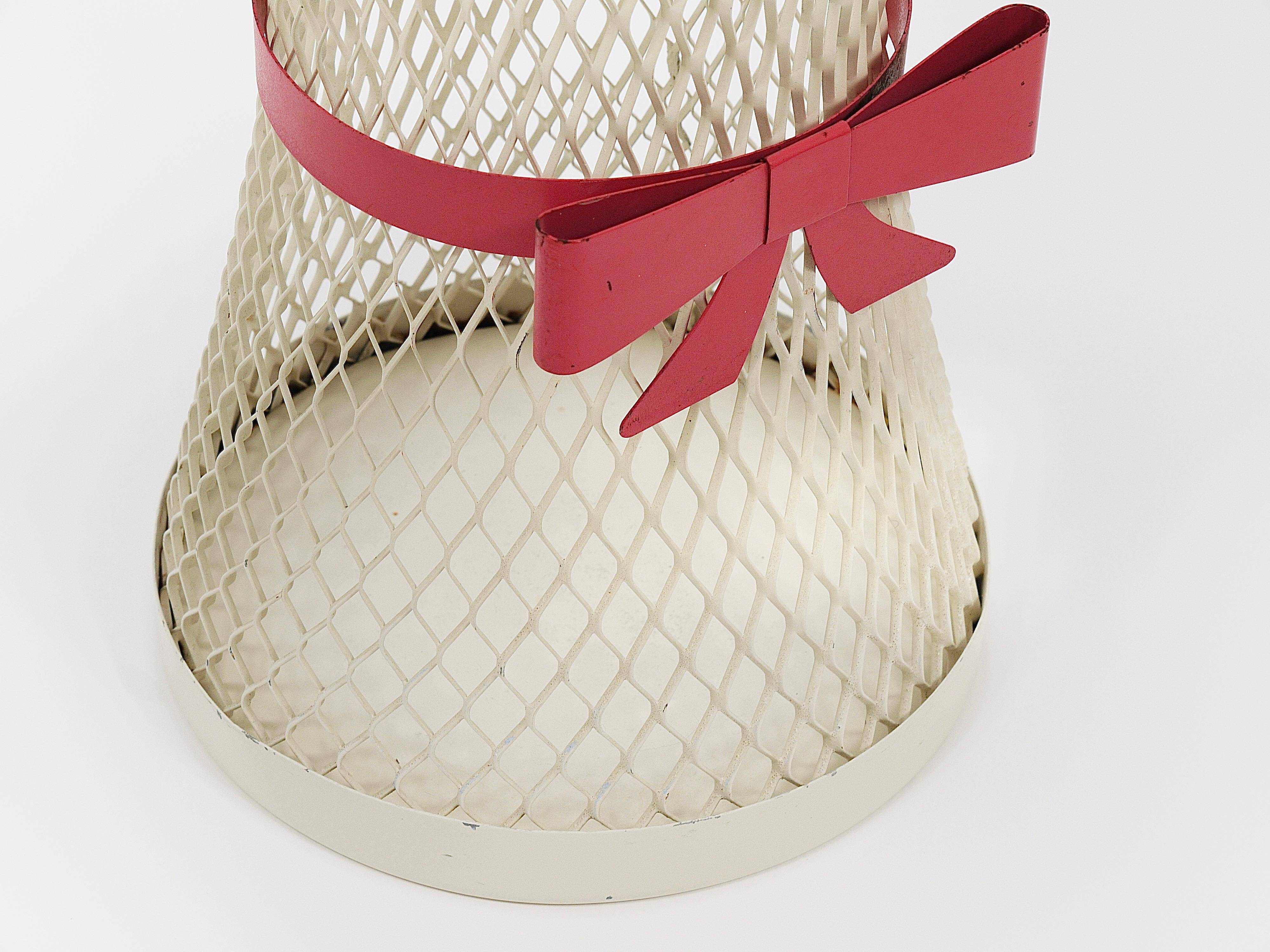 Bow tie umbrella stand in the style of Mathieu Matégot, mid-century, metal, France, 1950s.