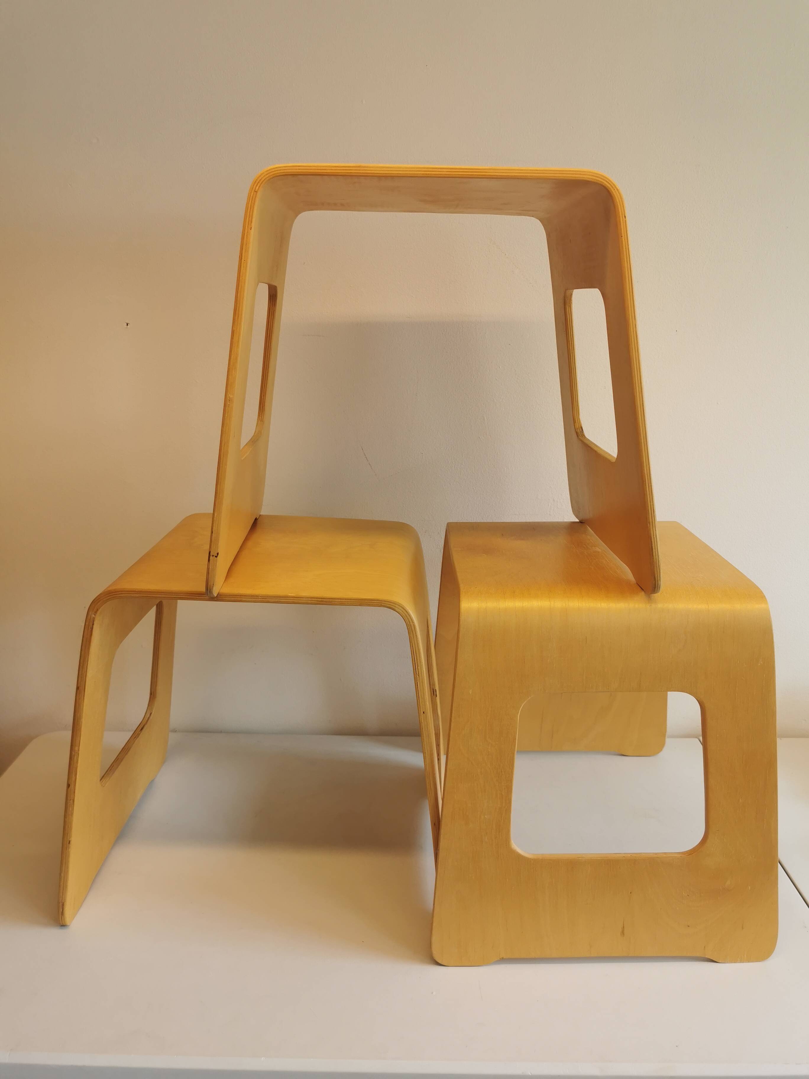 Design stool/side table made of curved plywood.