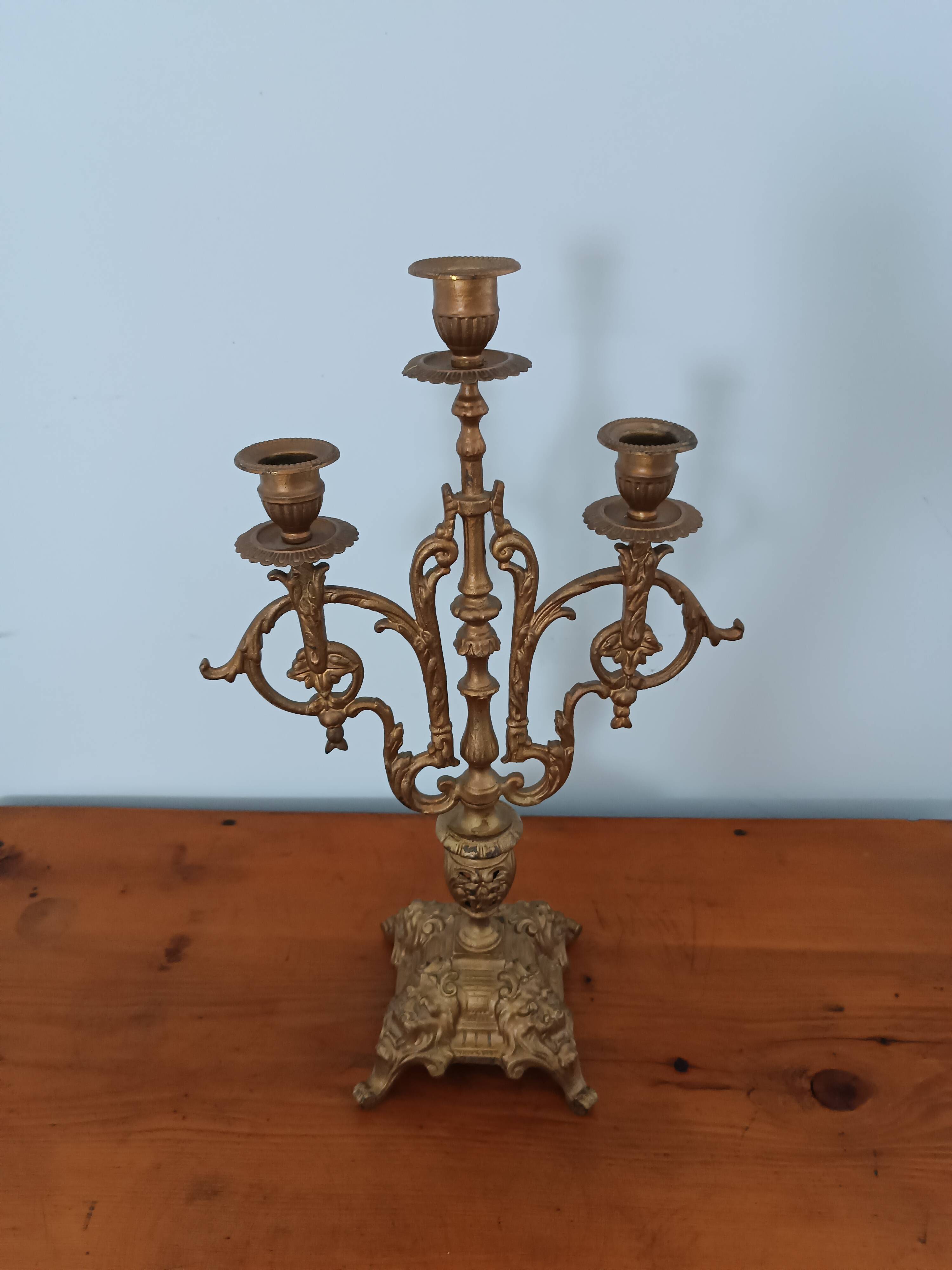 Bronze candlestick with lion head decoration
