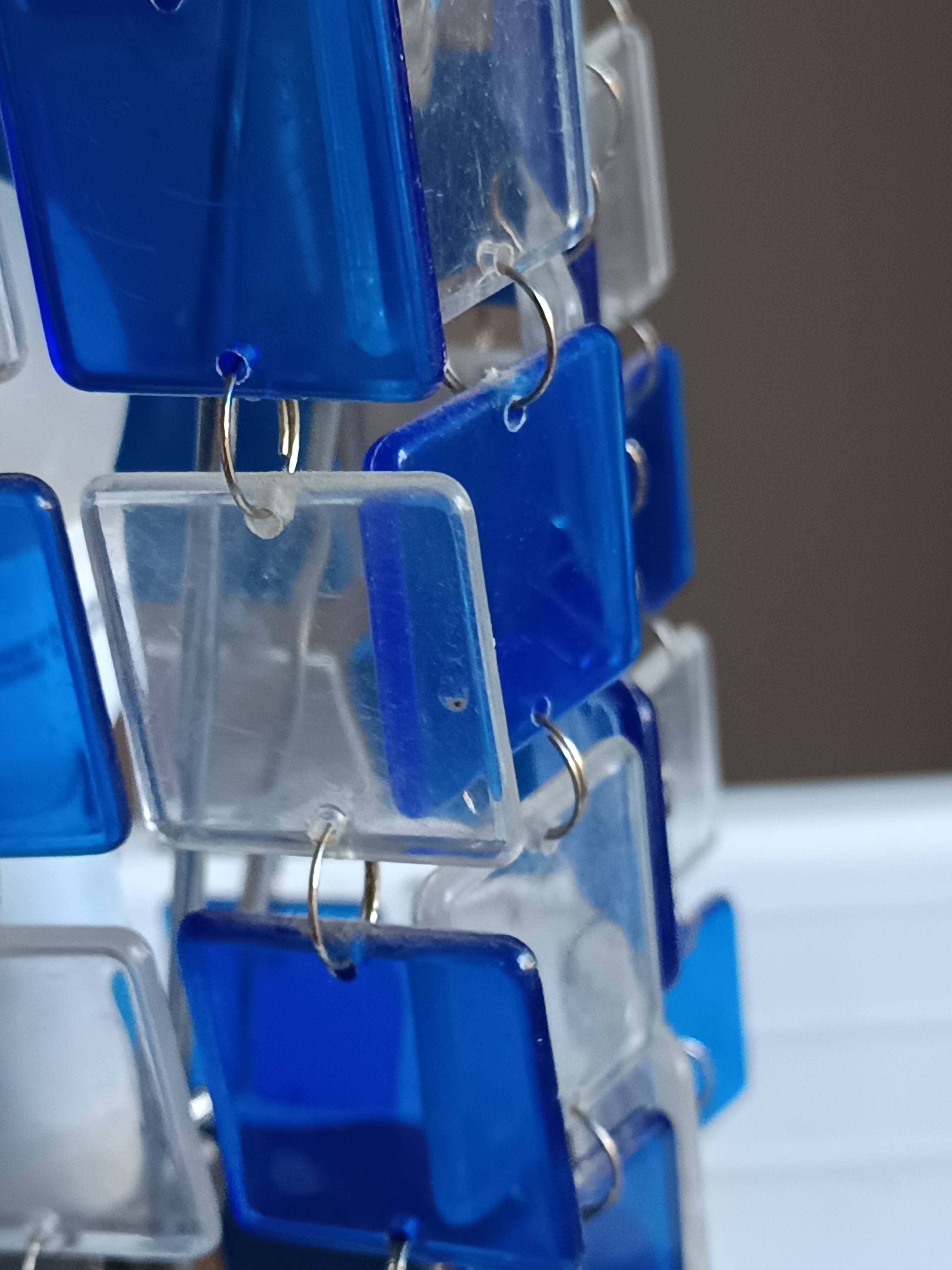 1970s designer table lamp with blue and clear plexiglass pendants.