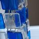 1970s designer table lamp with blue and clear plexiglass pendants.