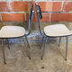 Pair of antique chrome metal chairs + white formica seat & back