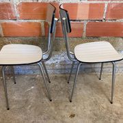 Pair of antique chrome metal chairs + white formica seat & back