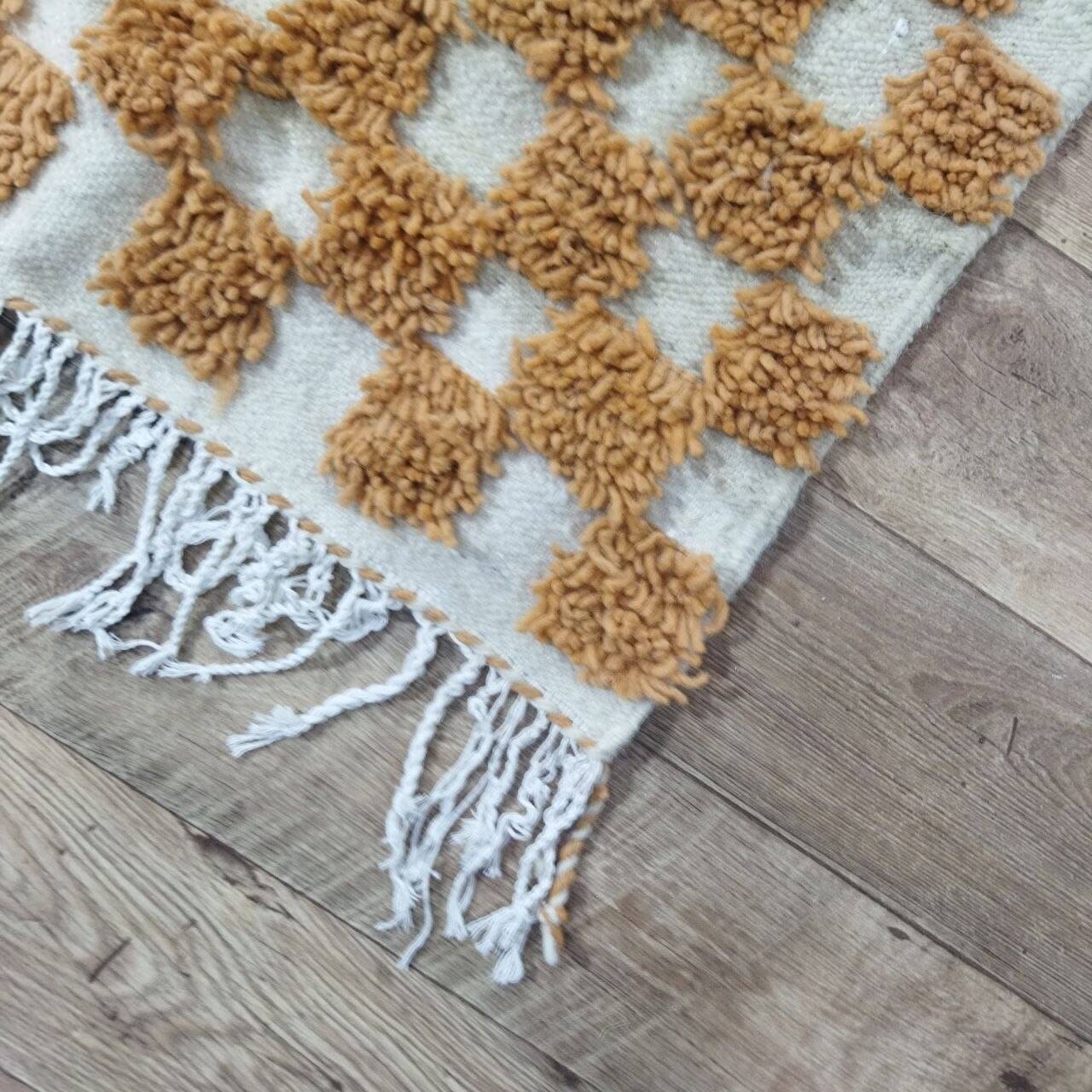 Moroccan Berber rug in ecru and camel wool with a graphic pattern, 245x150 cm.