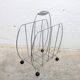 Vintage chrome magazine rack with ball feet