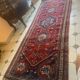 Large antique Oriental hallway carpet made of hand-knotted wool.