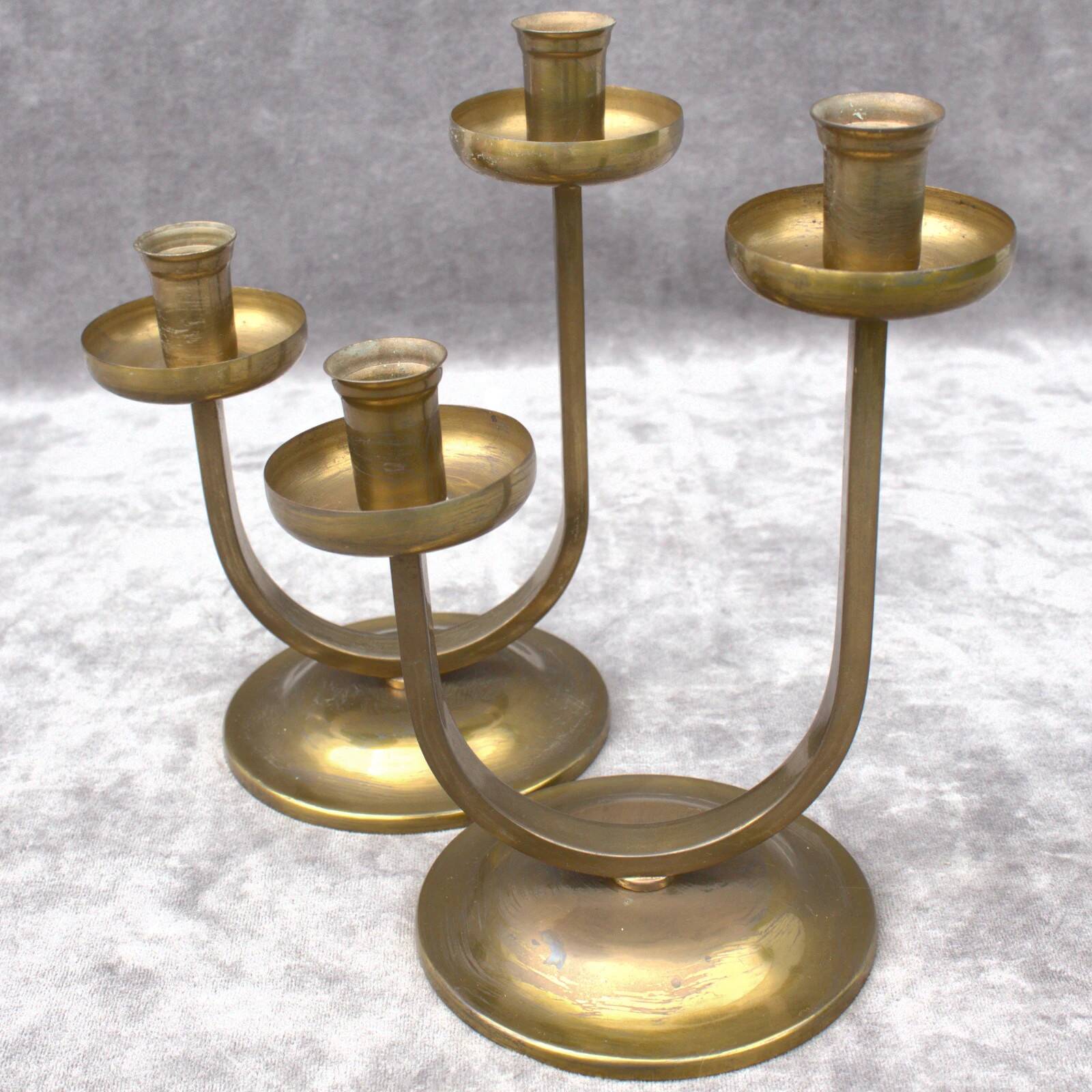 A beautiful pair of antique French Art Deco brass candlesticks