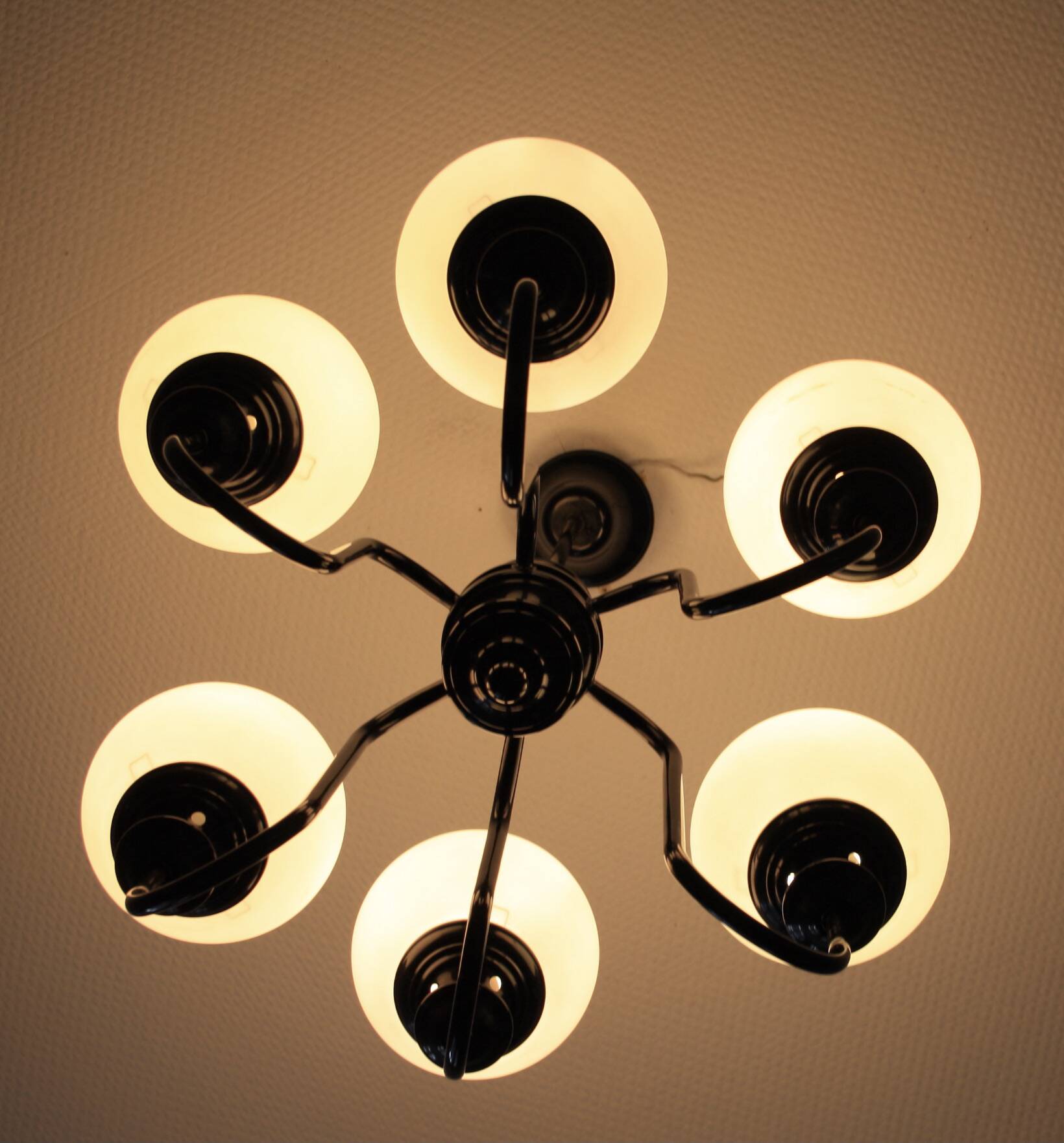 Metal chandelier and glass globes