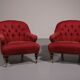 Pair of French red fabric button back armchairs